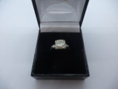 Platinum ring with central diamond, approx 1.75 CARAT, many inclusions, flanked by 2 smaller