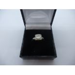 Platinum ring with central diamond, approx 1.75 CARAT, many inclusions, flanked by 2 smaller