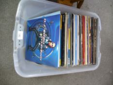 A crate of 12 inch vinyl singles, mainly 80s