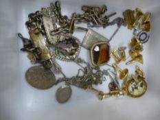 A silver locket, a silver identity bracelet and sundry