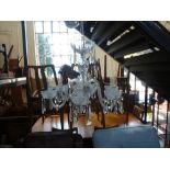 A Waterford chandelier with six branches and cut glass drops. Originally purchased in the 1990's