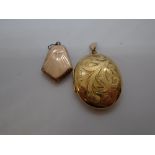 Large oval 9ct yellow gold locket, marked 375, 8.8g and a another Art Deco style locket, marked