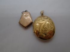 Large oval 9ct yellow gold locket, marked 375, 8.8g and a another Art Deco style locket, marked
