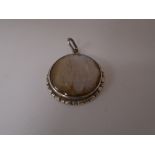 Vintage circular silver pendant, set with butterfly wing