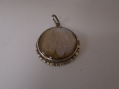 Vintage circular silver pendant, set with butterfly wing