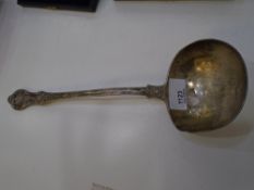 A large heavy silver ladle, stamped London 1872 Charmer and Co, weight approx 9.6 ozt. Decorative