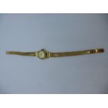 18ct yellow gold 'DOGMA' ladies wristwatch with 18ct case and strap, both marked 750, total weight
