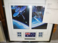 A stamp Art framed display for the Space Shuttle Discovery which carried the official Aussat flag,