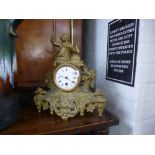 A French gilt metal figural mantel clock