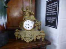 A French gilt metal figural mantel clock