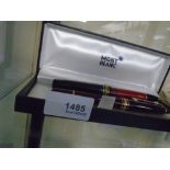 MONTBLANC; a Hemmingway ball point and a maroon fountain pen