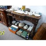 A Victorian carved oak breakfront hall table with three drawers and lower shelf, width 133cms