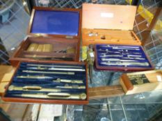 An early 20th century drawing set by Stanley, in mahogany case and a quantity of similar items