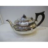 A silver teapot with a decorative border, hallmarked Sheffield 1933, Sydney Hall and Co., gross