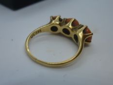 14K yellow gold dress ring set with three coral stones, size O, total weight approx 4g