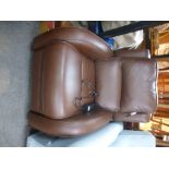 A modern brown leather electric reclining chair