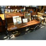 A Victorian style urn and wooden slatted bench having black painted ends, 167cms