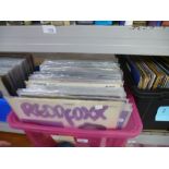 A similar crate of LPs