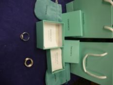 Two Tiffany rings, stamped 925, with boxes and bags