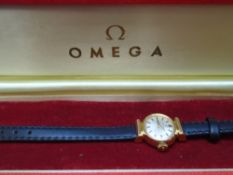 Vintage ladies Omega wristwatch with black leather strap in an Omega presentation box, very light