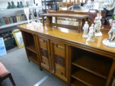 Doveston, Bird and Hull; an Aesthetic movement walnut sideboard with mirrored superstructure,