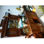 An early 20th century mahogany sideboard with mirror back and carved panels, width 133cms