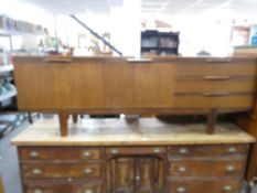 A vintage teak sideboard having three drawers, length 213 cms