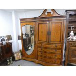 A good quality Edwardian inlaid satinwood wardrobe having single mirror door bedside four drawers