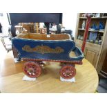 A painted vintage Gypsy style child's pull along wagon having long handle, body length 65cms, with 2