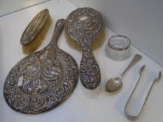 A Silver very decorative hand mirror stamped Birmingham 1911, maker's mark unknown, dressing table