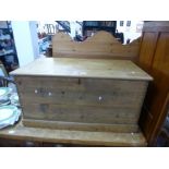 An old stripped pine blanket box on plinth base, 91cms and a vintage childs toy dog