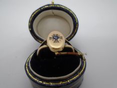 Unmarked yellow metal signet ring with sapphire and four small diamonds, size M, weight approx 2.8g,