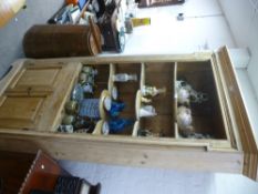 An antique pine barrel back corner cupboard having four open shelves, width 115cms