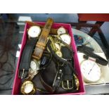 A pocket stopwatch and other wristwatches