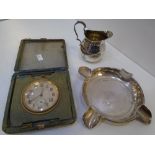 A silver ashtray hallmarked Sheffield 1925 Walker and Hall, with a small silver gilt jug, hallmarked