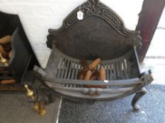 An old cast iron fire basket with brass decoration and one other