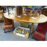 A vintage teak extending dining table on turned legs, probably G-Plan, length extended 170cms