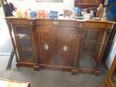 A Victorian burr walnut Credenza, having pair of central cupboard doors with four turned pillars,