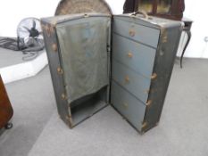 An early 20th century wardrobe travelling trunk by the Osh Kosh Trunk Company