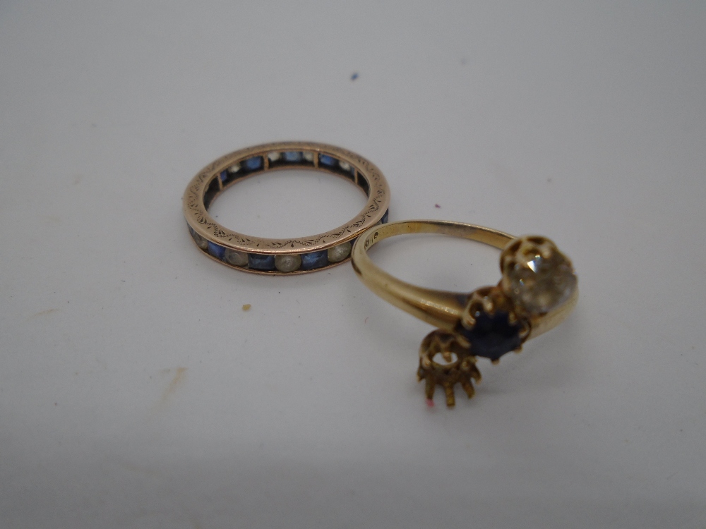 14ct yellow gold dress ring set with central blue stone and a diamond, marked 585, size M, and