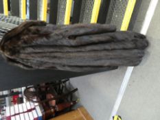 A ladies brown fur coat