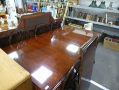 A reproduction Victorian style extending dining table, having one leaf, a set of eight Georgian