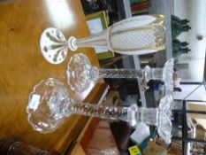 A pair of Georgian style glass candlesticks having facet cut stems and a Bohemian enamel and glass