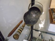 A miniature scuttle, made from gun shell and three other items