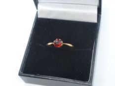 9ct rose gold ring, set with a garnet, size J/K