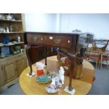 An antique oak side table having one long drawer and two small flaps, 78cms