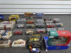 A quantity of die cast boxed vehicles, by mixed manufacturers