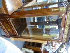 A French style pillar display cabinet, having gilt metal mounts with inlaid panel and a corner table