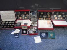 A 1937 Specimen coin set in red leather case, three proof sets and sundry coins