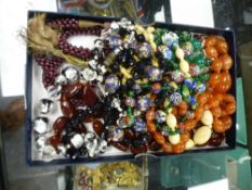 Costume jewellery to include hardstone necklaces, hand painted examples bone etc.